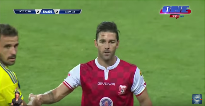 shaking hands in middle of soccer game