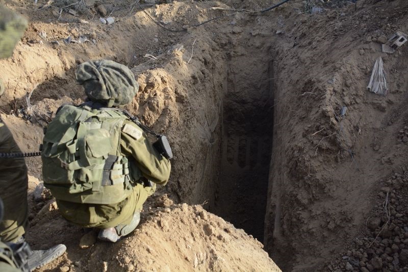 IDF soldier kneeling next to terror tunnels