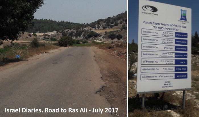 road to Ras Ali and sign showing intention to upgrade the road
