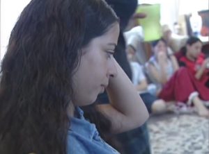 Israeli Jews and Palestinian Arabs making friends at a co-existence workshop