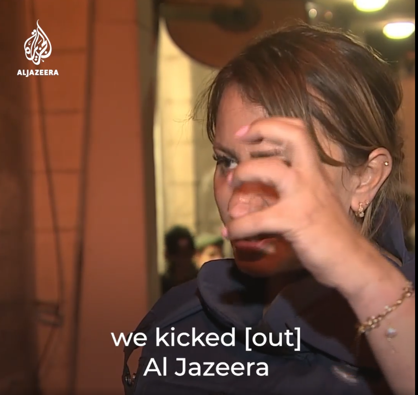 moments after her release she is shown using her "broken" arm on an Al-Jazeera interview
