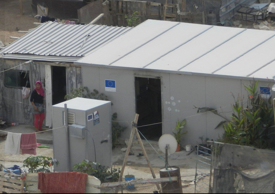 EU sign on caravan in illegal outpost in Area C