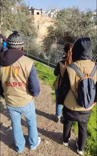 EAPPI activists showing the logo on their vests